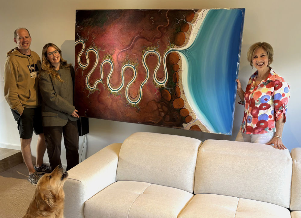 Tania Chanter delivering her painting to a first time collector