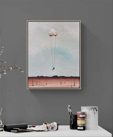 Surreal scene of girl swinging on swing suspended on a cloud above Australian outback scene. 