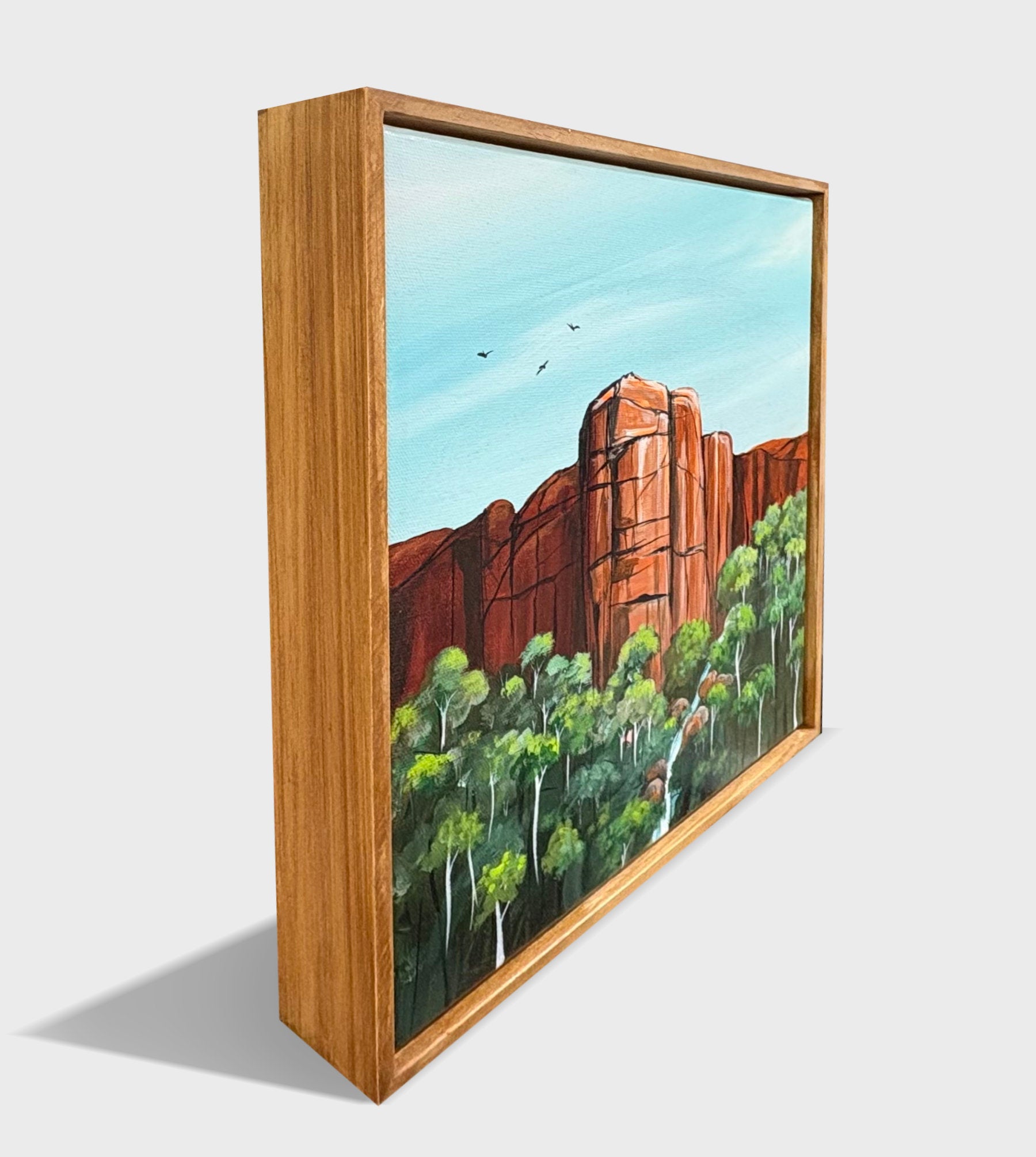 Framed in natural solid timber frame, Red Rock Sanctuary is an abstract landscape by Australian artist Tania Chanter, 32x32cm, acrylic on canvas.