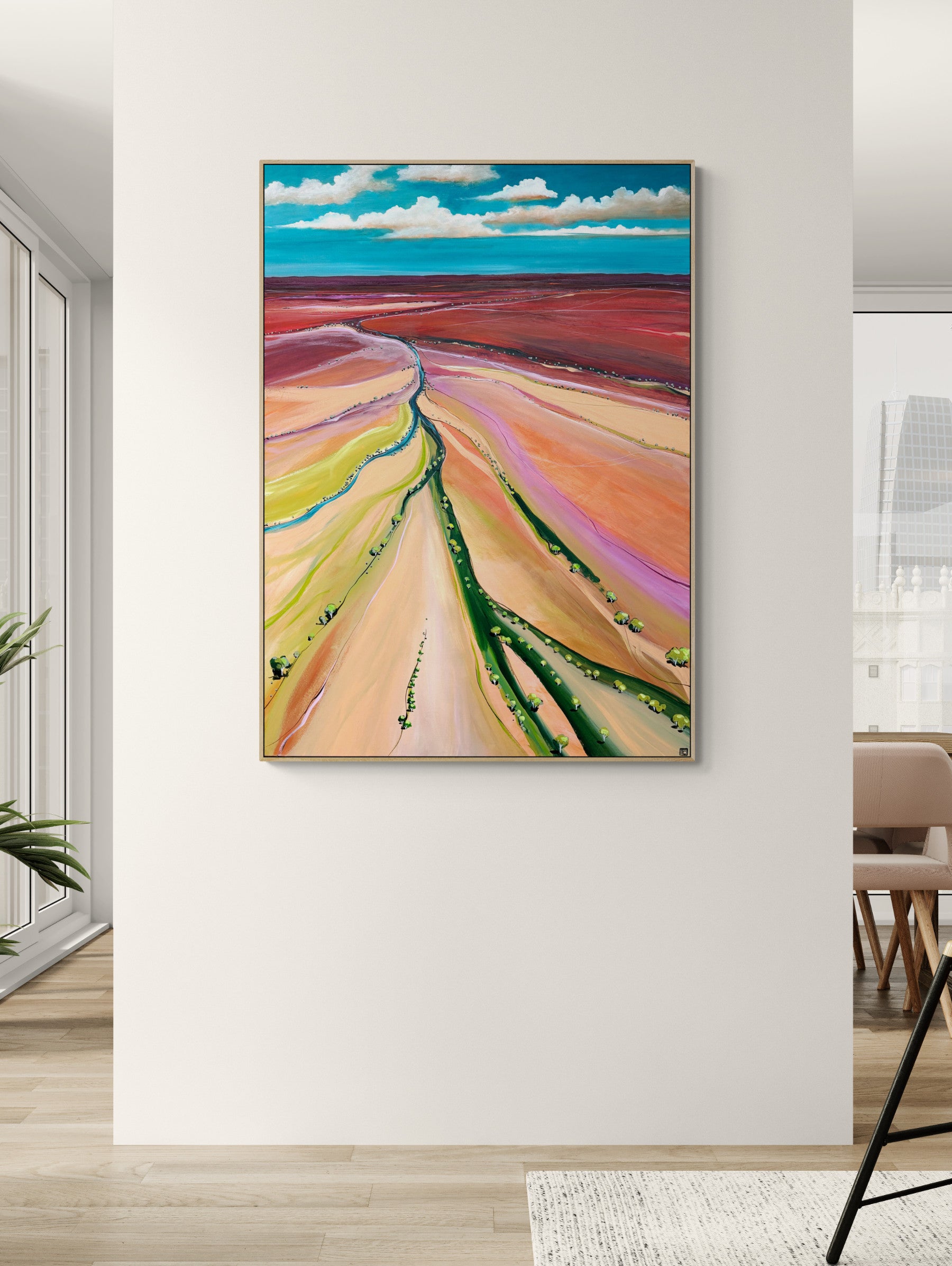 Colorful abstract landscape painting on a white wall