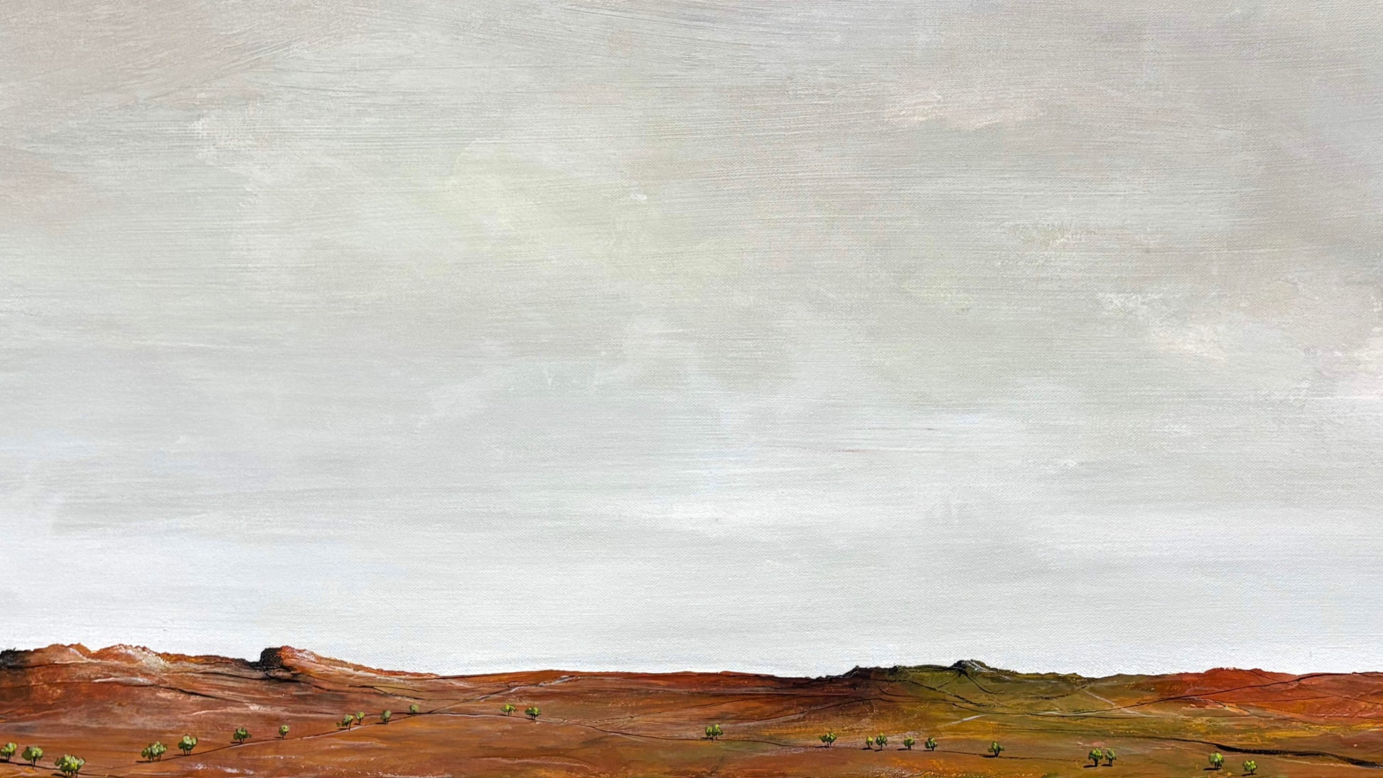 Close-up view of textured acrylic layers in The Light of Summer abstract landscape painting, showing soft blues, whites and subtle golden tones.
