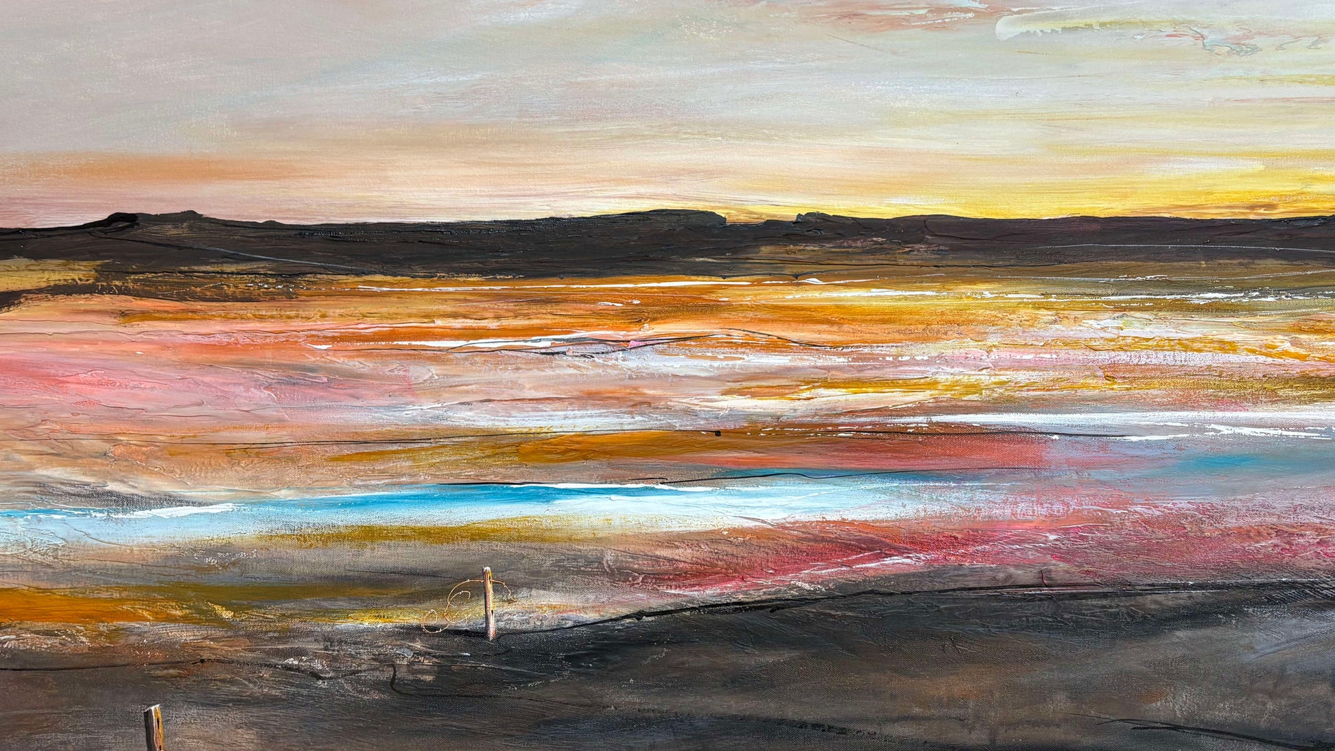 An abstract landscape painting featuring a wide, textured field of earthy tones including yellow, orange, pink, blue, red, and dark brown, with a hazy sky at the top.