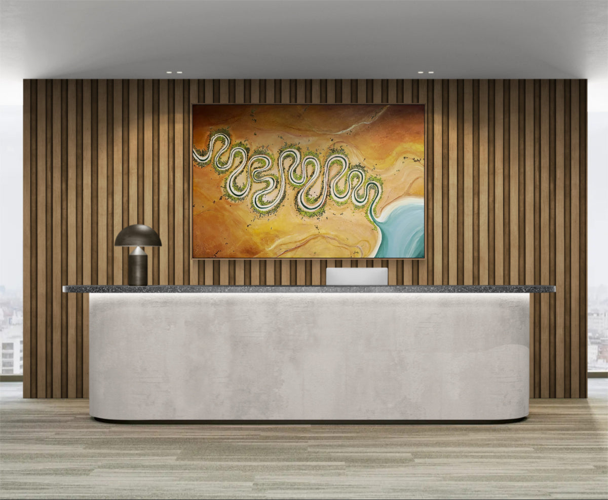 A large abstract canvas painting featuring wavy green and blue lines over a textured orange and brown background, displayed on a wood-paneled wall above a modern reception desk in a minimalist office setting.
